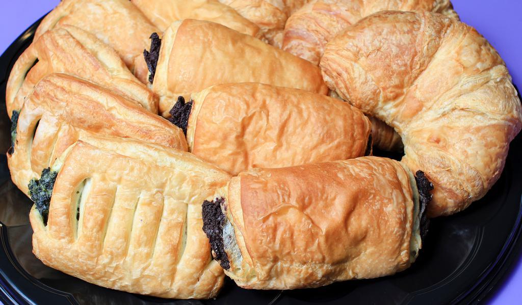 Croissants · 128 layered flaky, buttery croissants come plain, filled with chocolate fudge, and spinach, kale and cheese.