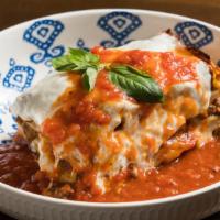 Lasagna Bolognese · Homemade pasta layered with beef and pork bolognese and bechamel sauce.