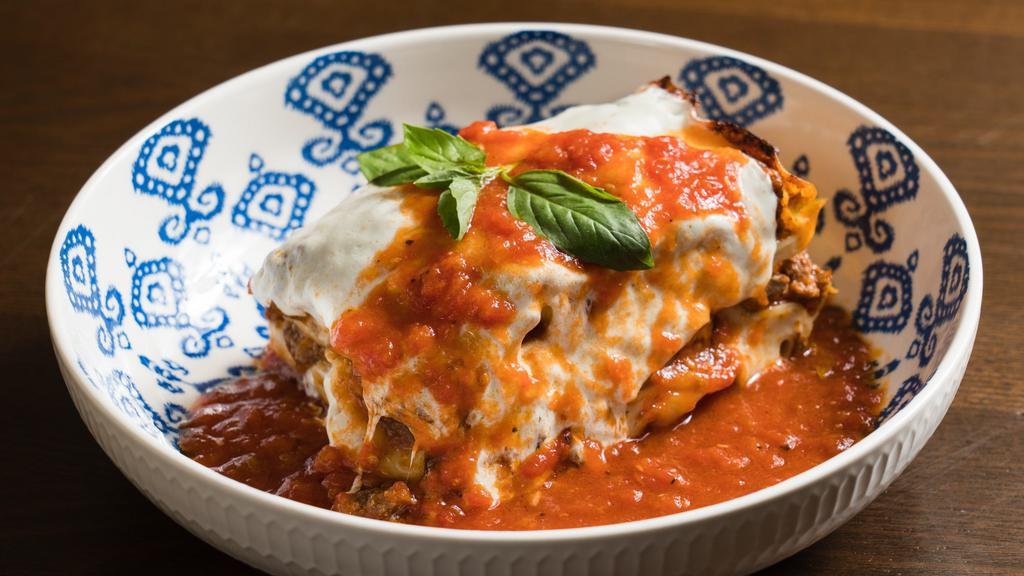 Lasagna Bolognese · Homemade pasta layered with beef and pork bolognese and bechamel sauce.