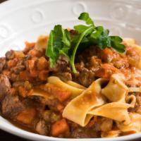 Pappardelle Agnello · Braised lamb with carrots, celery, onions, served over pappardelle.