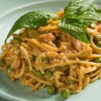 Pasta E Piselli · Hand cut spaghetti, green peas, pancetta and eggs.