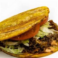 Patacon · Double fried plantains on top & bottom with your choice of grilled meat, served with lettuce...