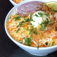 Goat Dum Biryani · Our signature dish - fragrant basmati rice layered and slow cooked with choicest cuts of goa...
