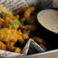Alligator Bites · Deep-fried alligator tail meat, served with house-made remoulade sauce.