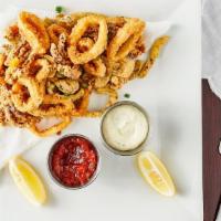 Crispy Calamari · Rings, tentacles, sweet pepper strips, scallions, cocktail and lemon-caper sauce.