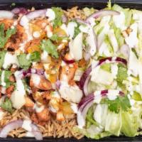 Chicken Over Rice · Our specialty grilled chicken topped with grilled onions & cilantro, on top of fresh basmati...