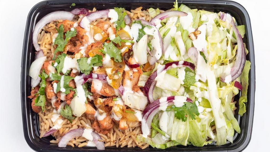 Chicken Over Rice · Our specialty grilled chicken thigh marinated with our secret blend of spices & ginger with lettuce, red cabbage, onions, cilantro, and sauce.