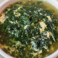 Stracciatella Alla Romana · Egg drop soup with spinach.
