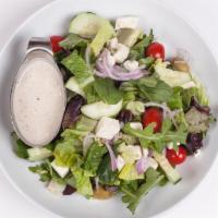 Greek Salad · Red onions, black olives, tomatoes, cucumber, roasted red pepper, stuffed grape leaves and c...