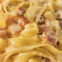 Carbonara · Diced onions and bacon in a cream sauce.