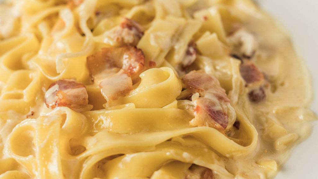 Carbonara · Diced onions and bacon in a cream sauce.