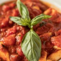 Homemade Gnocchi · Soft dumpling pasta in tomato sauce.
