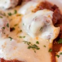 Shrimp Parmigiana · Breaded & fried with melted mozzarella and tomato sauce.