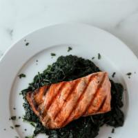 Grilled Salmon · Over spinach sauteed in garlic and oil