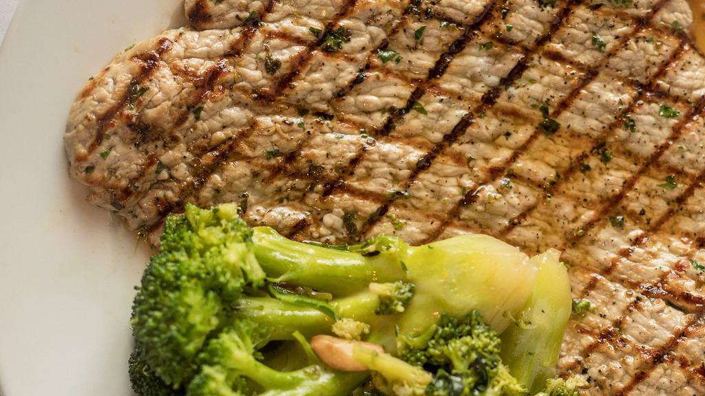 Veal Paillard With Broccoli · Grilled tender nature veal marinated with fresh herbs.
