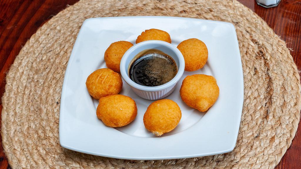 Nuegados De Yuca Con Chilate · Fried yuca dumplings with rice flour drink.