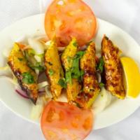Chicken Reshmi Kabab · Skewered chicken rolls.
