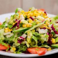 Mediterranean Salad · Romaine lettuce, tomatoes, cucumbers, red cabbage and corn topped mixed with olive and lemon...