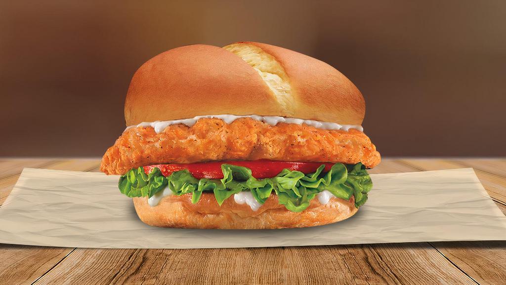 Spicy Chicken Sandwich · A fiery hot, crisp 100% additive and preservative free chicken filet, topped with crisp lettuce, juicy tomatoes, and mayonnaise on a freshly baked bun. Try it on it’s own, or make it a special with fries and a soda.