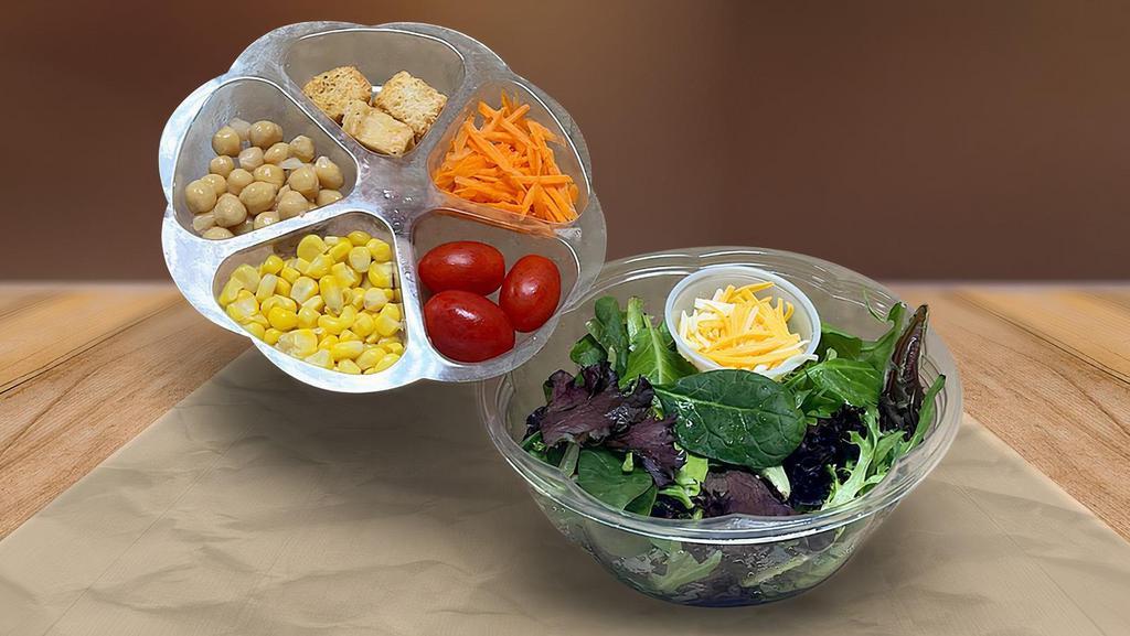 Garden Salad · 32 oz of freshness ! Ingredients: Baby Mixed Greens. Packed Separately: Grape Tomato, Cucumber, Cheddar Cheese, Monterey Jack Cheese, Crotons.