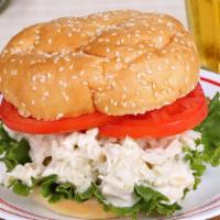 Chicken Salad Sandwich · Delicious Chicken Salad sandwich served with cheese, lettuce, tomato, and onions.