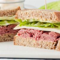 Pastrami Sandwich · Delicious Pastrami sandwich served with cheese, lettuce, tomato, and onions.