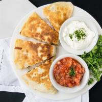 Chicken Quesadillas · Served with salsa and cheddar cheese pico de gallo and sour cream on the side.