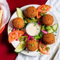 Falafel Appetizer · Favorite. Special blend of chickpeas, fava beans, Lebanese spices and tahini sauce.