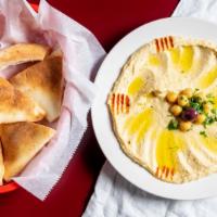 Hummus · Seasoned chick pea and tahini dip. Served with pita bread.