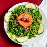 Tabouli Salad · A healthy Lebanese salad. Made with fresh parsley, tomato, onion, extra virgin olive oil, bu...