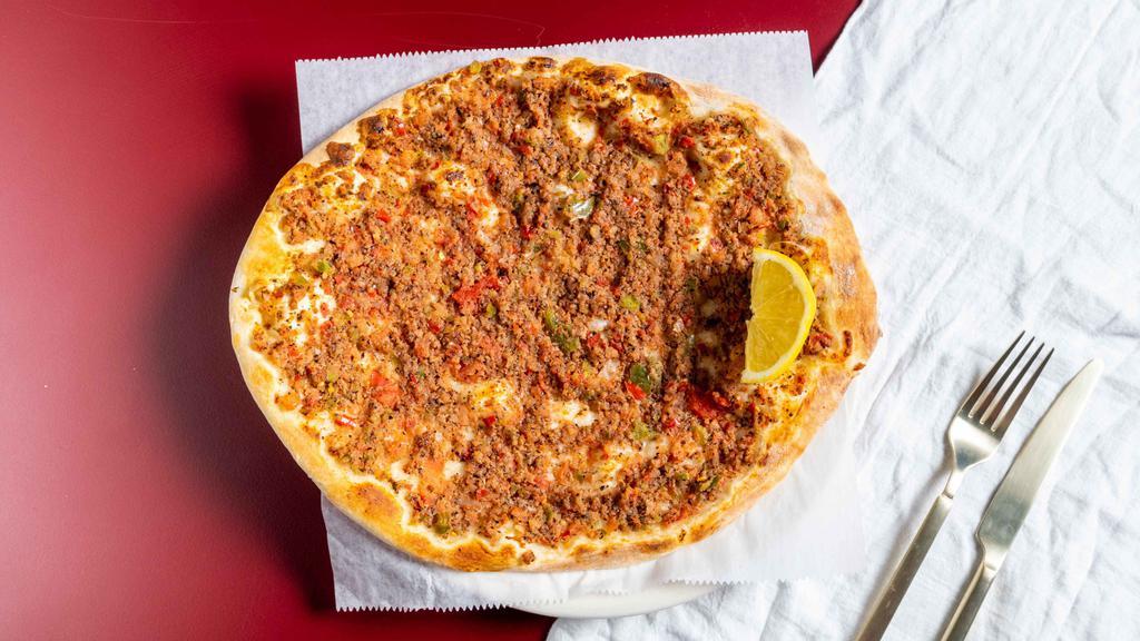 Lahmajin Manakeesh · Our special dough topped with a blend of ground beef, onion, tomato and sumac spice.