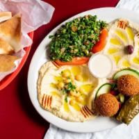 Vegetarian Plate · Hummus, Baba, falafel, choice of salad, assorted pickles and sauce. Served with fresh pita b...
