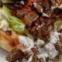 Lamb Gyro · All natural halal chicken comes in a pita with lettuce, tomato, onions, cucumbers and white ...
