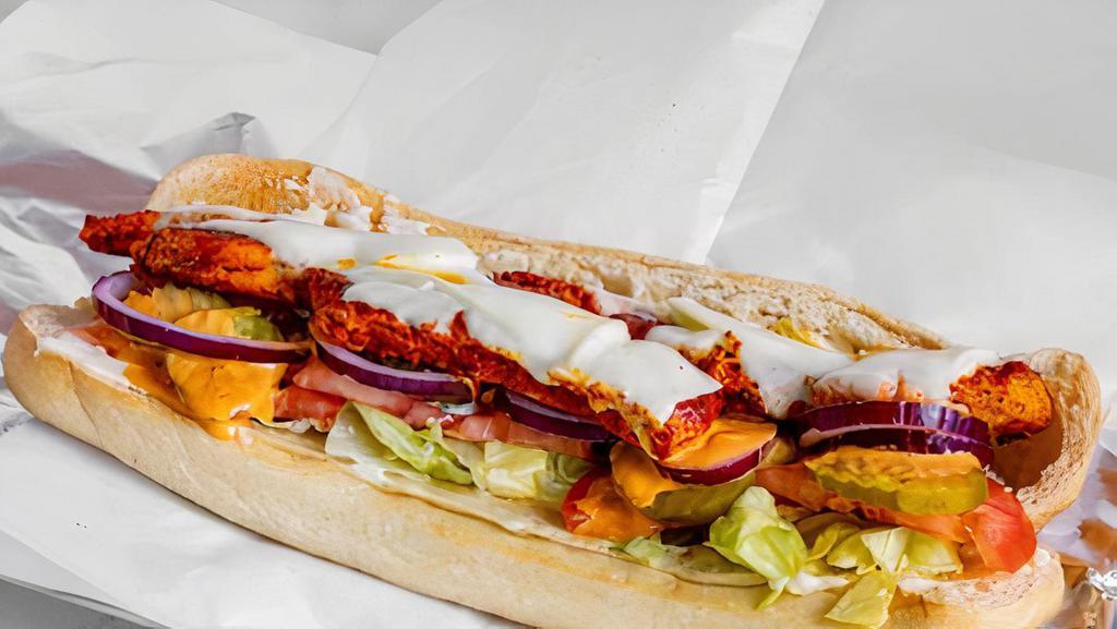 Chicken Cutlet Cut · On a hero with mayo, lettuce, tomatoes, onions and cheese.