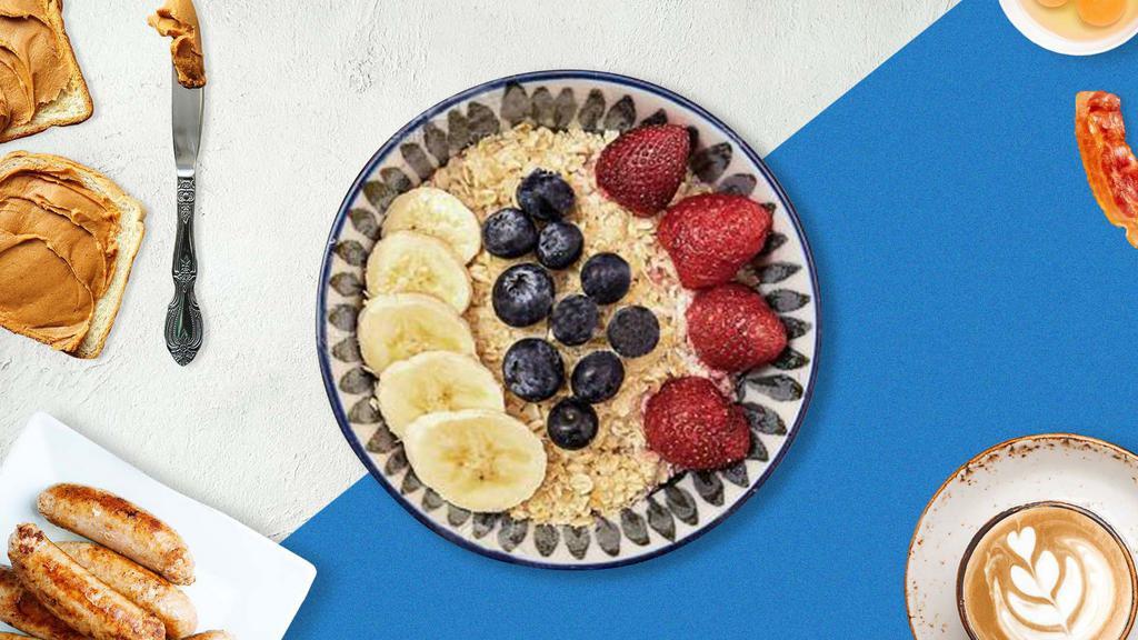 Classic Oatmeal Bowl · (Vegan) Our warm oatmeal bowl is made from rolled oats, oat milk and topped with strawberries, blueberries, banana, hemp granola, shredded coconut, and maple syrup.