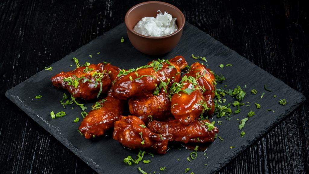 Hot Bbq Wings · Mouthwatering BBQ Sauce Wings Served with Blissful Bleu Cheese & Veggies.