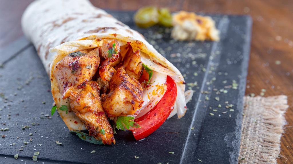 Chicken Souvlaki Wrap / Sandwich · Marinated grilled chicken, homestyle pita bread and delectable Greek salad, served in a wrap or sandwich. Prepared with a side of your choice.