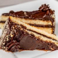 Chocolate Layer Cake · Vanilla cake filled and iced with rich chocolate fudge  and decorated with vanilla cake crum...
