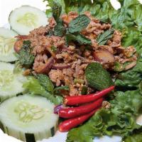 Larb Gai · Grounded chicken, red onion, glutinous rice, mints, scallions served with sticky rice