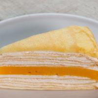 Mango Vanilla Crepe Cake · Crepe cake layer with Vanilla flavor stuffed with Mango.