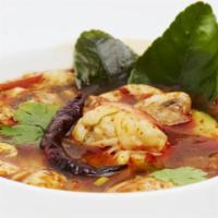 Tom Yum Koong Soup Large · Spicy. Shrimp, mushroom and scallion in chili lemongrass soup.
