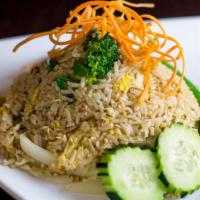 Thai Fried Rice · Stir-fried rice with onion, scallion, tomato, carrot, and egg.