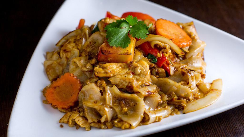 Drunken Noodles · Stir fried broad rice noodle with bell pepper, carrot, onion, tomato, and basil in basil chili sauce. Spicy
