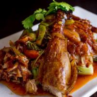 Duck Tamarind · Crispy roasted duck served with sauteed sweet spicy sour tamarind sauce garnished with steam...