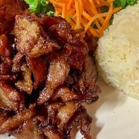 Sun Dried Marinated Pork · Sun dried marinated pork on the bed of lettuce and carrots served with sticky rice