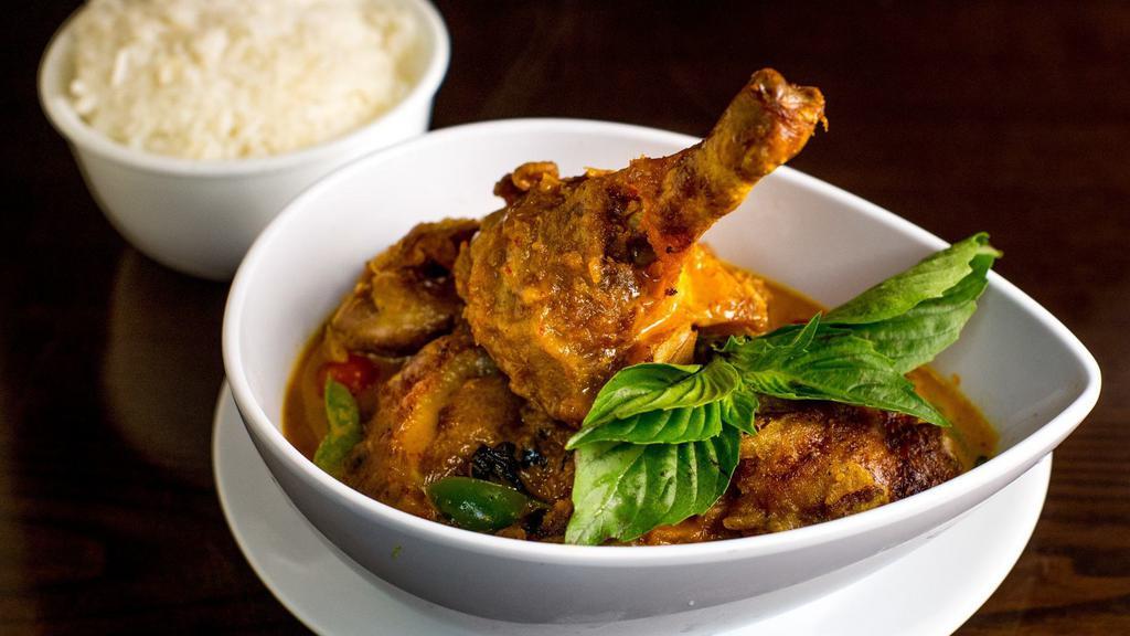 Rambutan Duck Curry · Half crispy duck with cherry tomato, rambutan, bell pepper, pineapple, carrot and basil in coconut milk red curry.