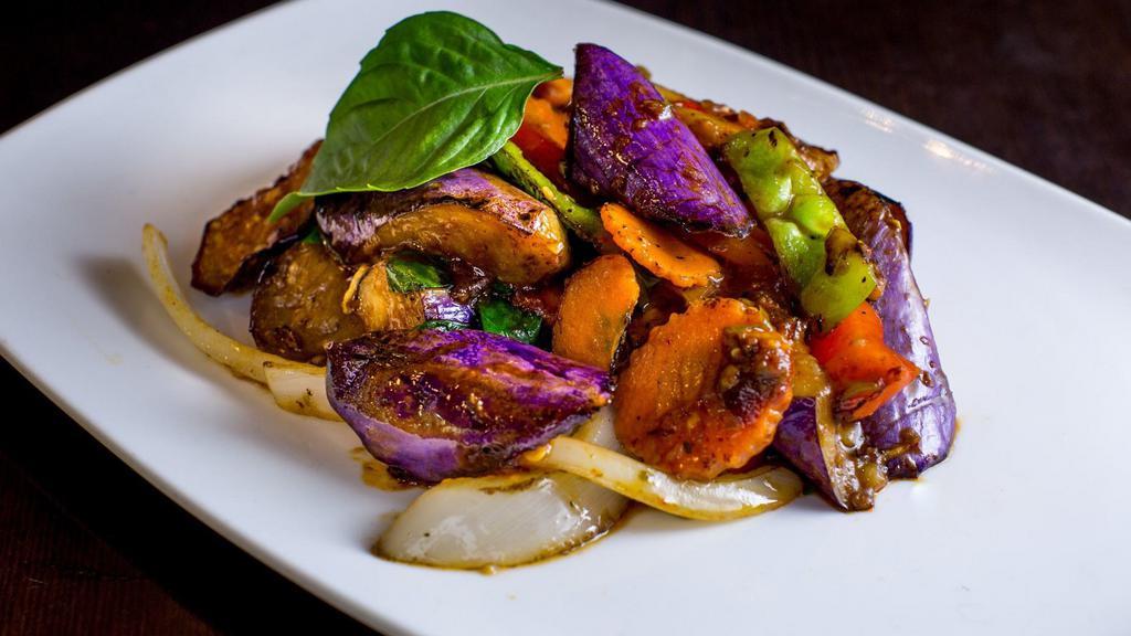 Basil Eggplant · Sauteed eggplant with onion, scallion, carrot, bell pepper and basil in spicy chili basil sauce. Spicy