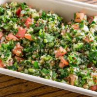 Small Tabouleh Salad · Finely chopped parsley, mint, tomatoes, cucumbers, lemon, olive oil, and quinoa.