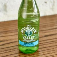 Mountain Valley Water · 11 oz premium period glass bottle.