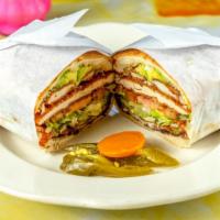 Carne Enchilada Torta · Spicy pork with spread of beans, melted cheese, onions, avocado, lettuce, tomatoes, and jala...